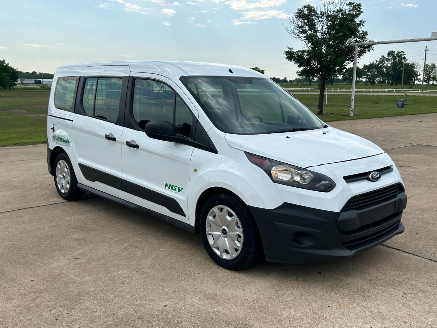 2014 White /Gray Ford Transit Connect Wagon XL w/Rear Liftgate LWB (NM0GE9E75E1) with an 2.5L L4 DOHC 16V engine, 6-Speed Automatic transmission, located at 17760 Hwy 62, Morris, OK, 74445, (918) 733-4887, 35.609104, -95.877060 - 2014 FORD TRANSIT CONNECT HAS 2.5L ENGINE, FEATURES POWER LOCKS, POWER WINDOWS, POWER MIRRORS, AM/FM STEREO, CRUISE CONTROL, BLUETOOTH HANDS-FREE CALLING, BACKSEAT,IT RUNS ON CNG (COMPRESSED NATURAL GAS) OR GASOLINE. A PREMIER ALTERNATIVE FUEL CONVERSION THAT IS EPA-APPROVED. EXTREMELY CLEAN-BURNING - Photo#2